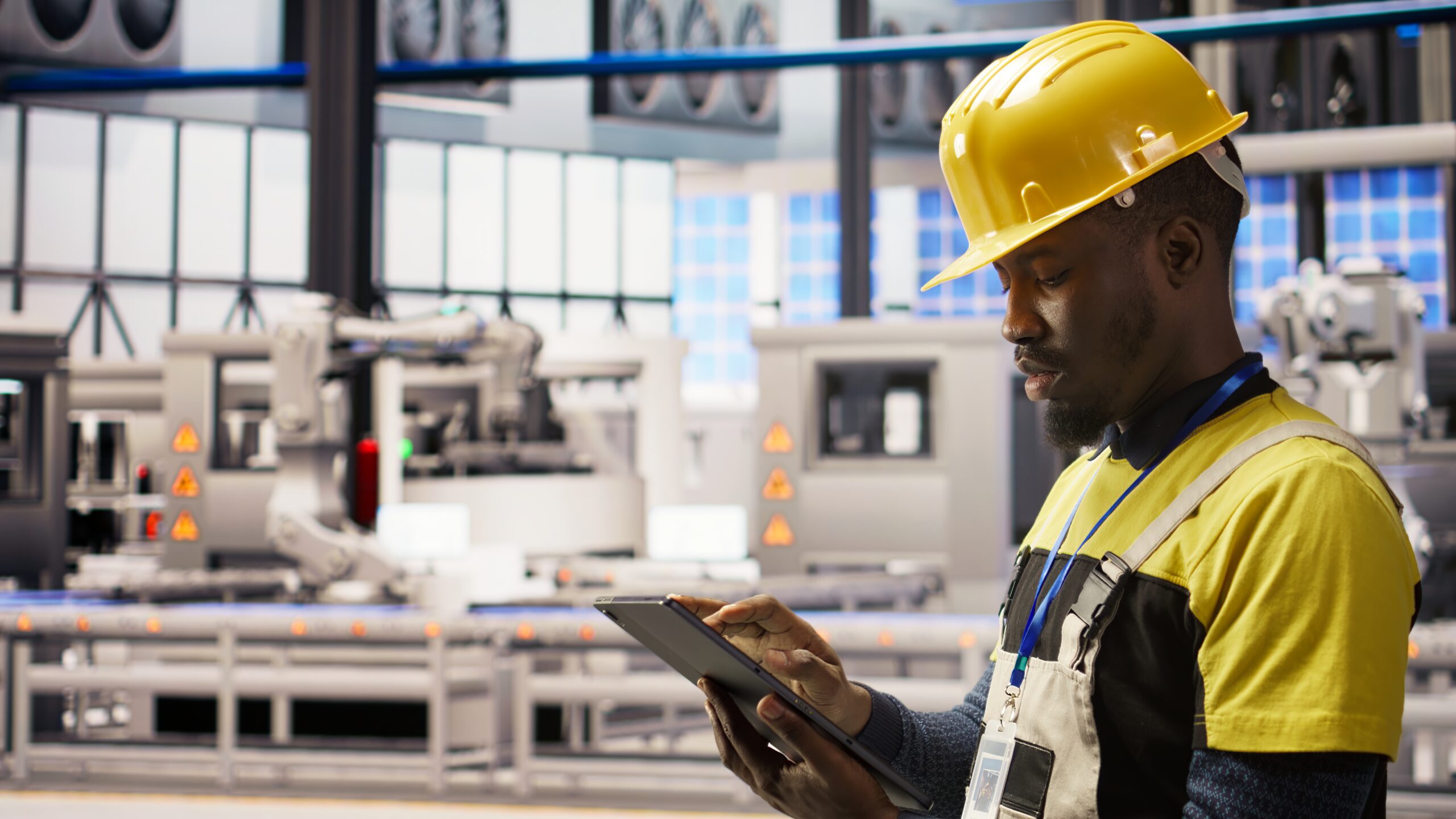 Smart factory specialist testing automated systems, monitoring operational integrity. Industry 4.0 plant technician inspecting equipment to identify and repair damages, camera A